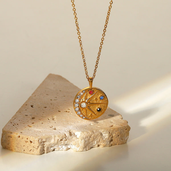 Necklace with a sun and moon embossed hammered colored zircon round medal pendant