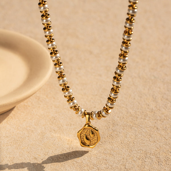 Adorned with a pearl coin inlay necklace